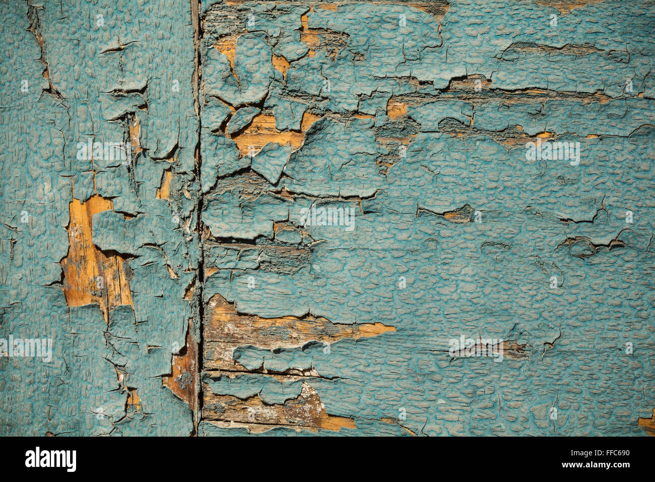 Vintage wood background with peeling turquoise paint Stock Photo
