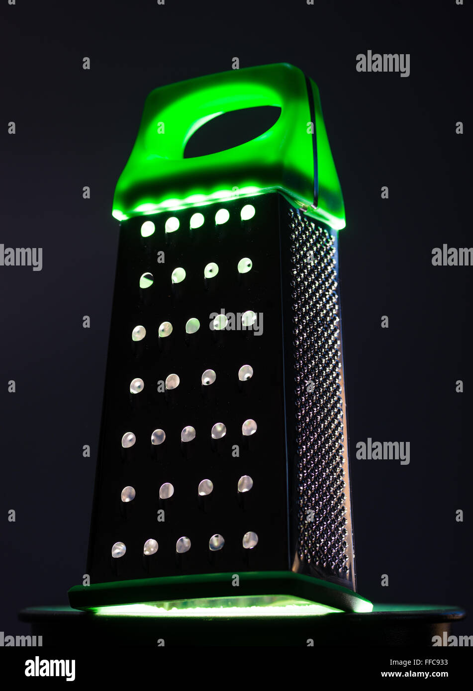 Food grater with green handle Stock Photo