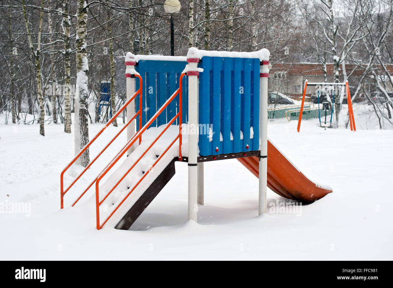 Kids' slide during winter in snow in Russia Stock Photo - Alamy