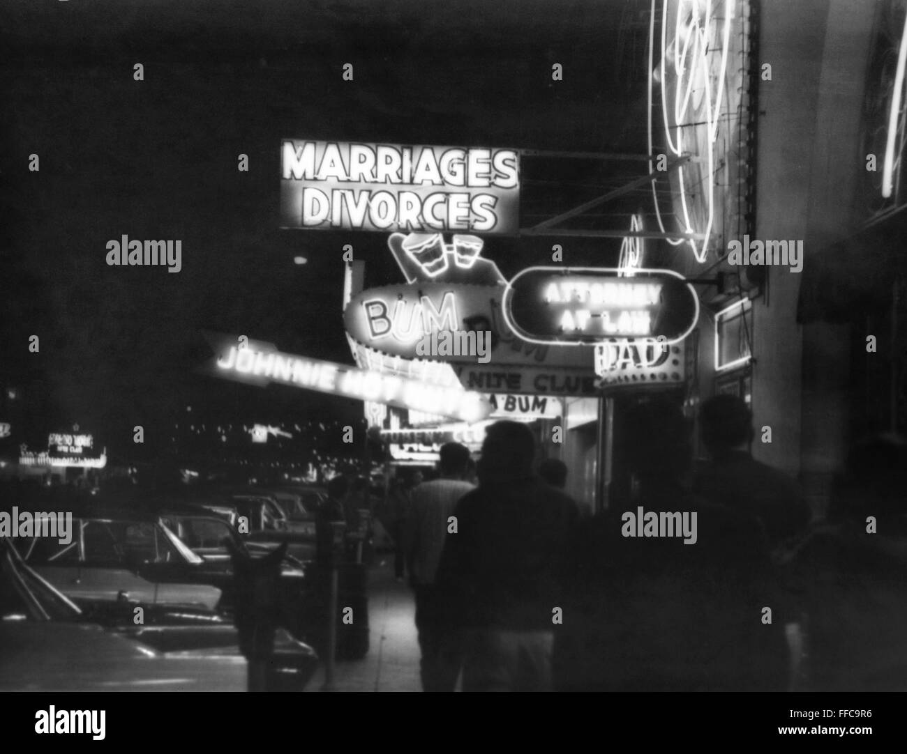 TIJUANA DIVORCE, 1950s. /nA street in Tijuana, Mexico, with neon signs for bars and quick marriages and divorces, mid-1950s. Stock Photo
