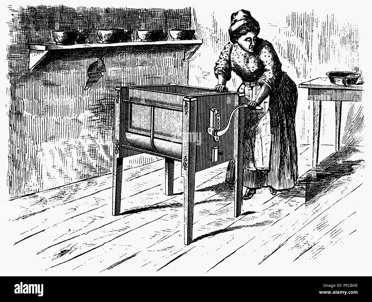 BUTTER CHURN, 1872. /nAmerican butter churn, 1872. Late 19th century line engraving Stock Photo