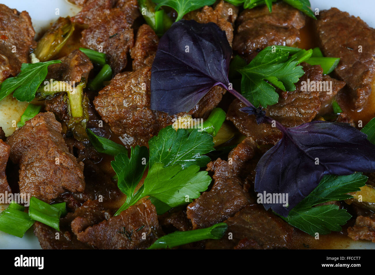 Stirfry meat with coriander leaves Stock Photo Alamy