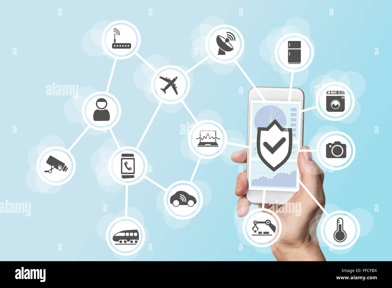 Internet of things security concept with hand holding modern smart phone to control intruders into a network of objects Stock Photo