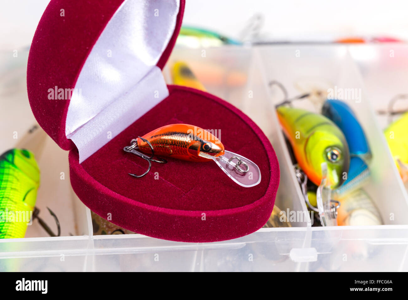 valentines day fishing surprise present - open red box of heart on tackles  storage with baits and lure Stock Photo - Alamy