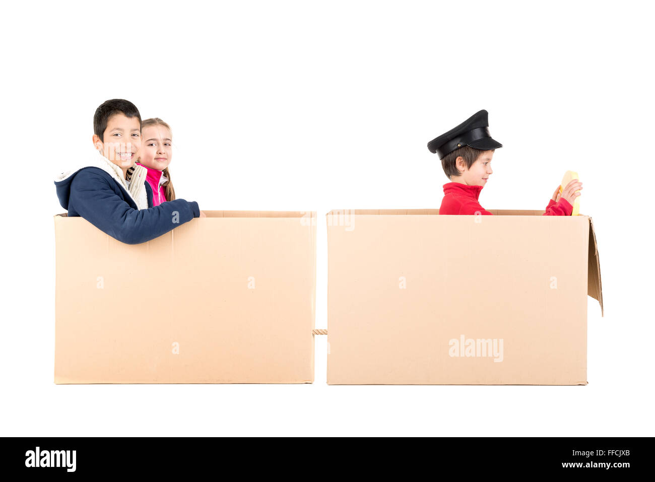 Children playing VIP people in a cardboard box limousine Stock Photo