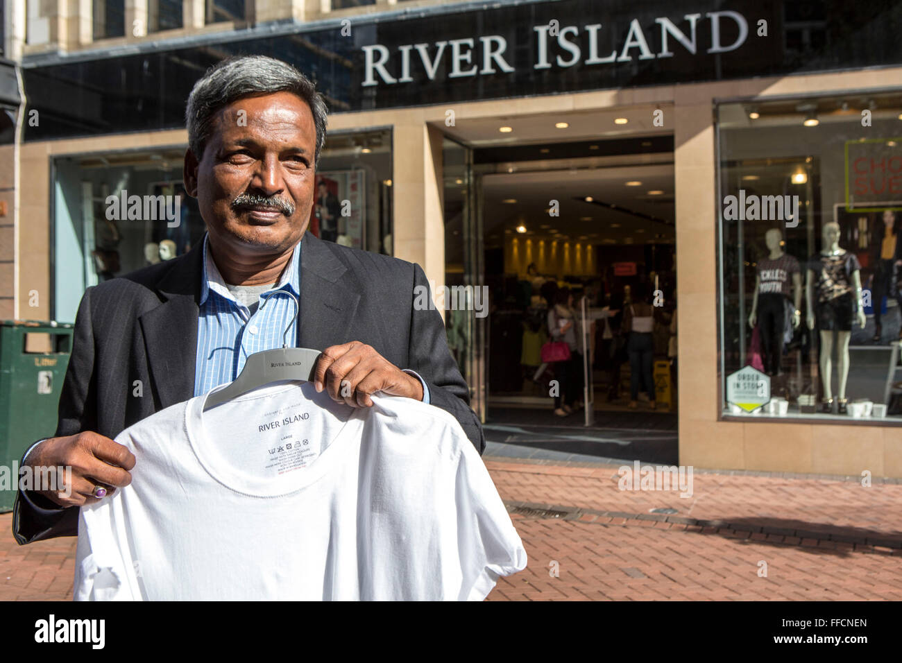 Amirul Haque Amir, President of Bangladeshi Federation of Garment Workers, outside River Island in Bournemouth, Dorset, United Kingdom. Stock Photo
