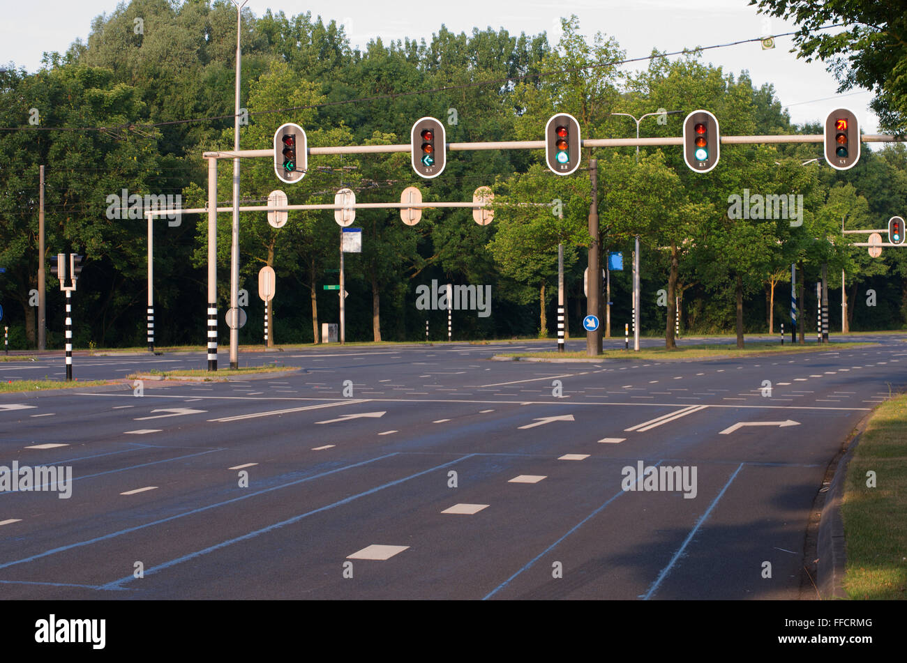 Empty traffic intersection with traffic lights. Stock Photo