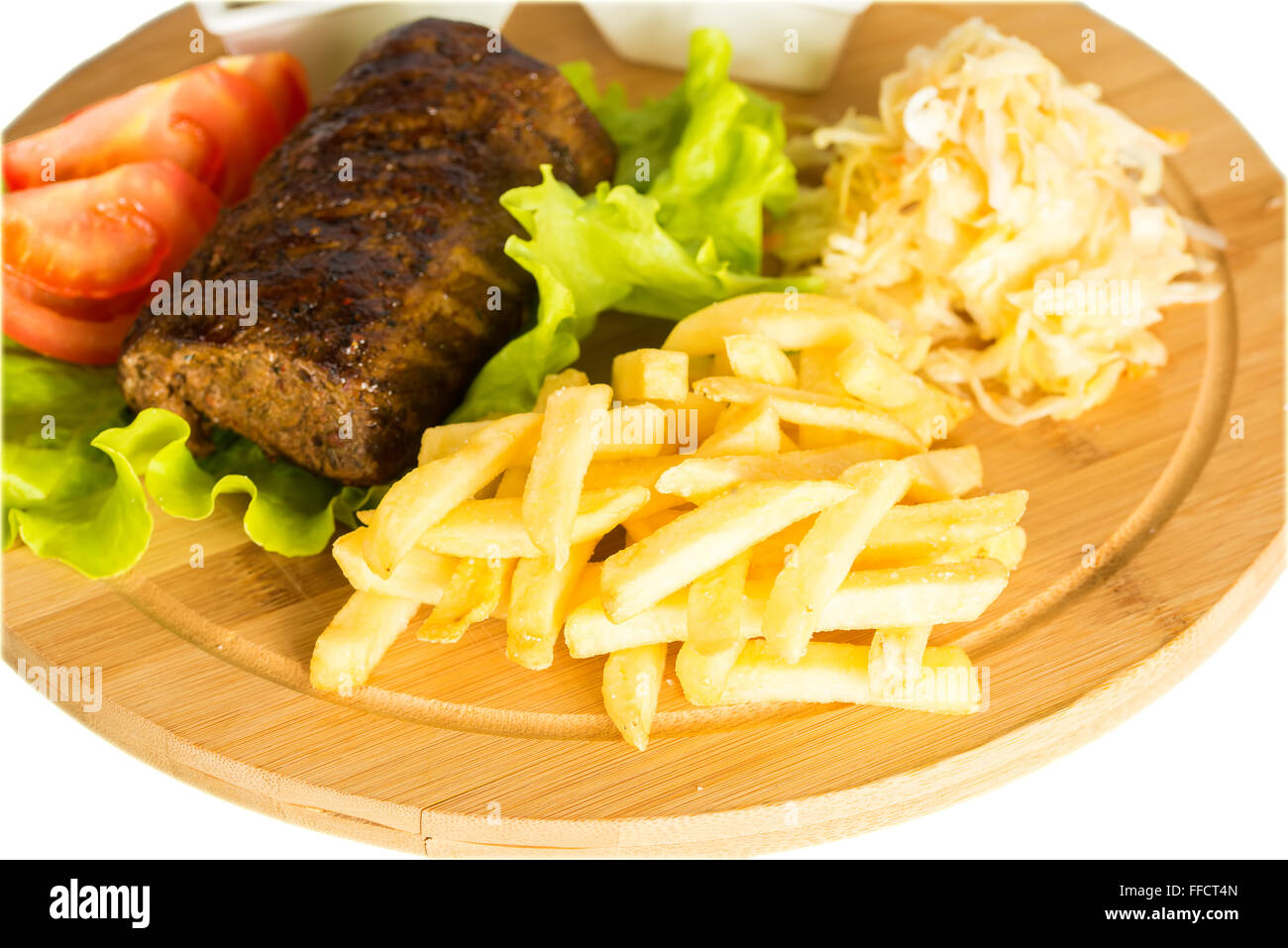 Baked meat, tomatoes and french fries Stock Photo Alamy