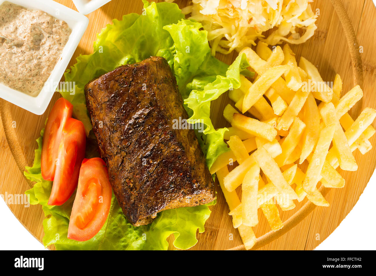 Baked meat, tomatoes and french fries Stock Photo Alamy