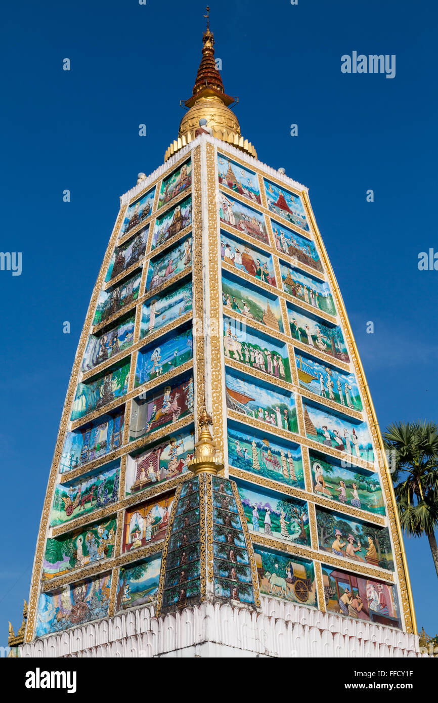 Tower depicting the life of Buddha at the Shwedagon pagoda in Yangon Stock Photo