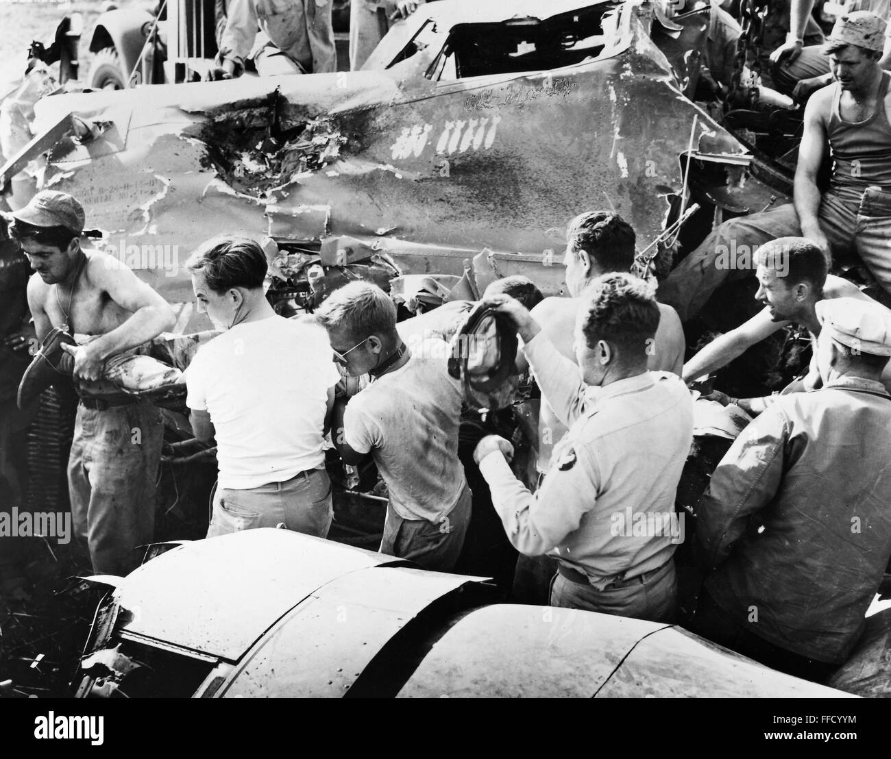 WORLD WAR II: B-24, 1944. /nA wounded gunner is brought out of a B-24 ...