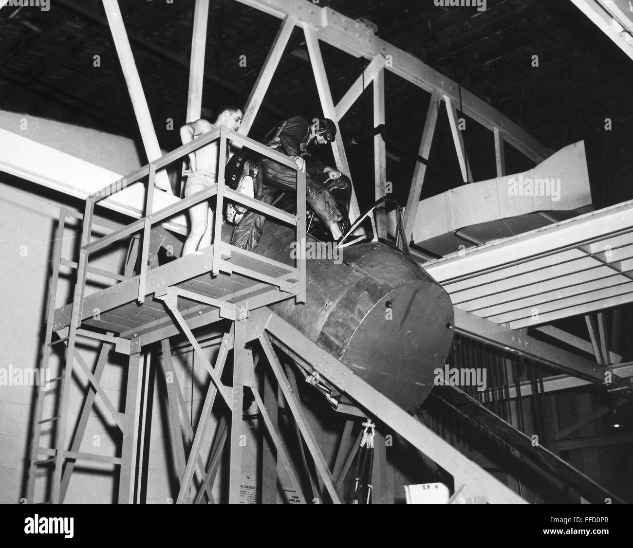 NAVY PILOT TRAINING, 1952. /nA U.S. Navy pilot steps into the cockpit