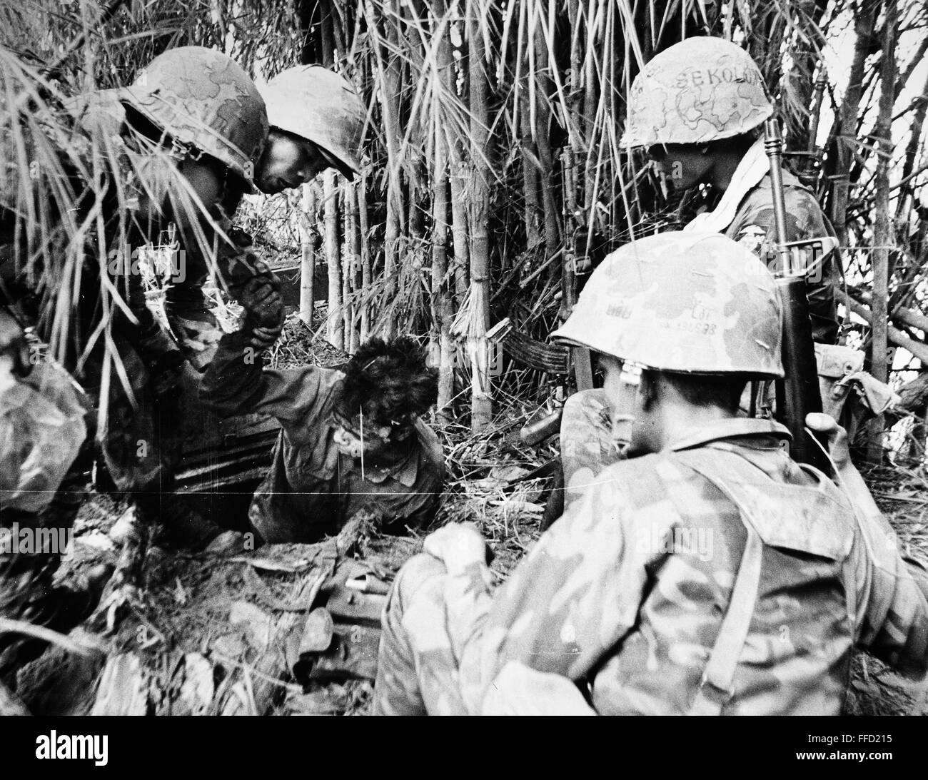 VIETNAM WAR: VIET CONG. /nMembers of a South Vietnamese Special Forces unit remove a Viet Cong from his hiding place during fighting near Saigon, 6 June 1968. Stock Photo