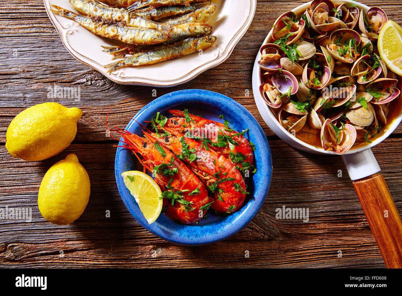 Tapas spanish seafood clams shrimps and fried anchovies fish Stock Photo Alamy