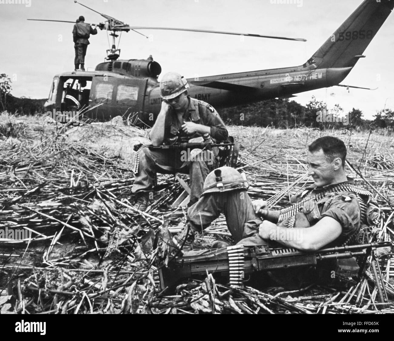 VIETNAM WAR: HELICOPTER. /nThe crew of an American helicopter take a ...