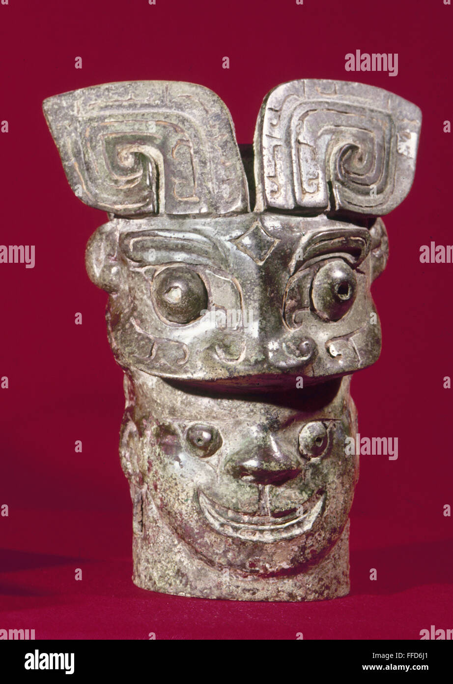CHINA: BRONZE FINIAL. /nBronze finial in the shape of a human head under t'ao-t'ich mask, late Shang Dynasty (c1766-c1122 B.C.), China. Stock Photo