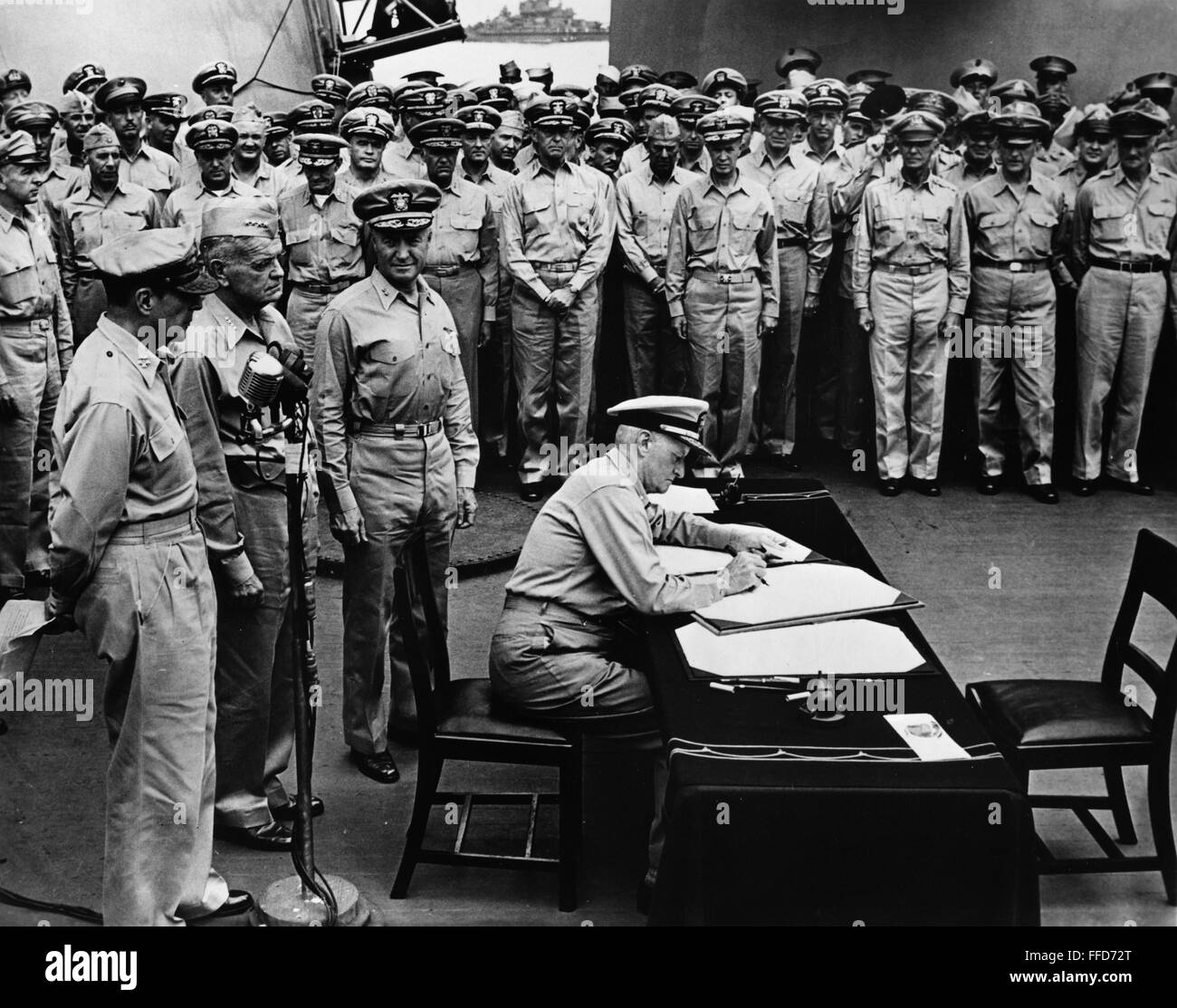 JAPANESE SURRENDER, 1945. /nU.S. Admiral Chester W. Nimitz signs the ...
