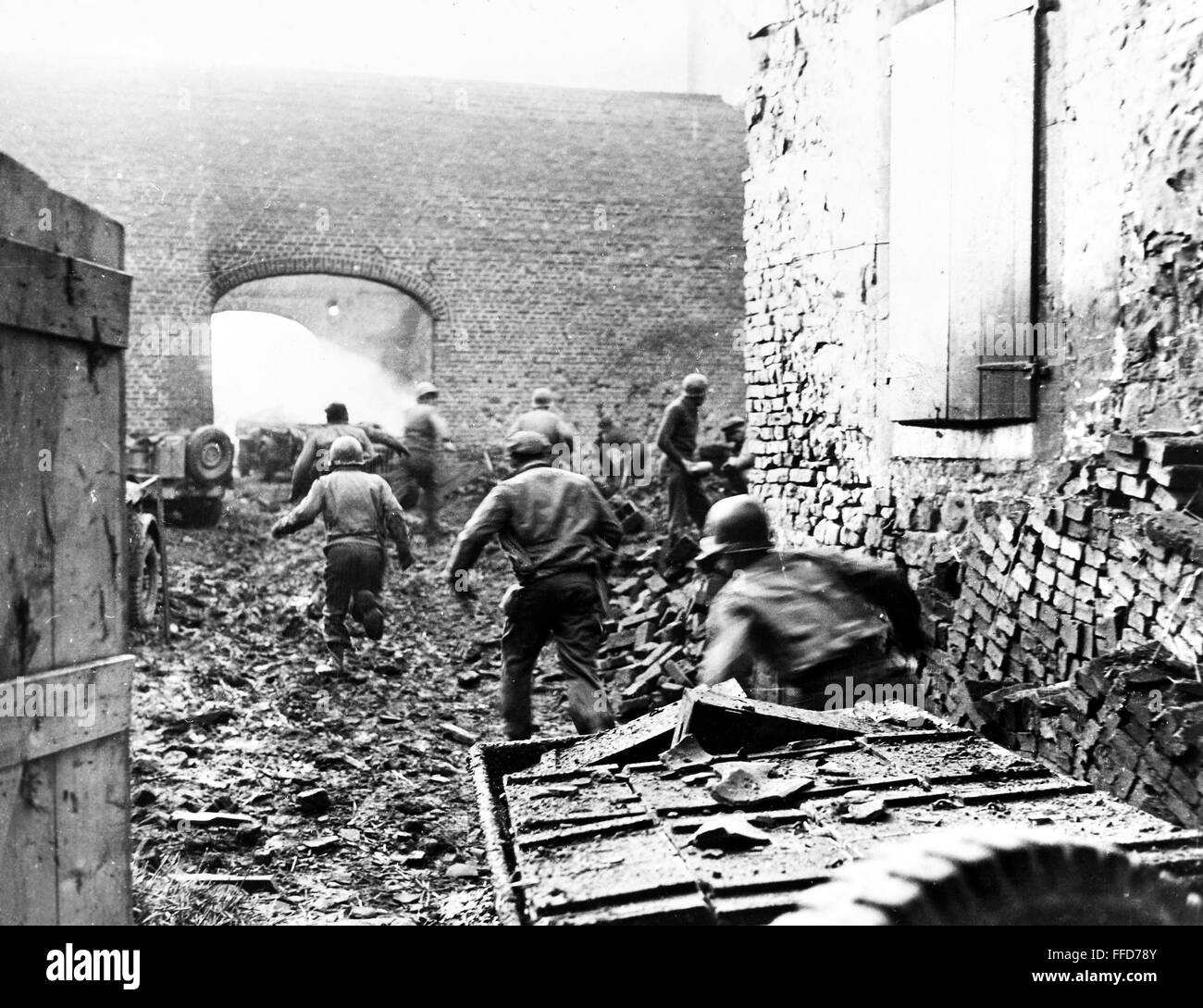 WORLD WAR II BOMBARDMENT. /nAfter a round of bombardment by artillery shells, members of the