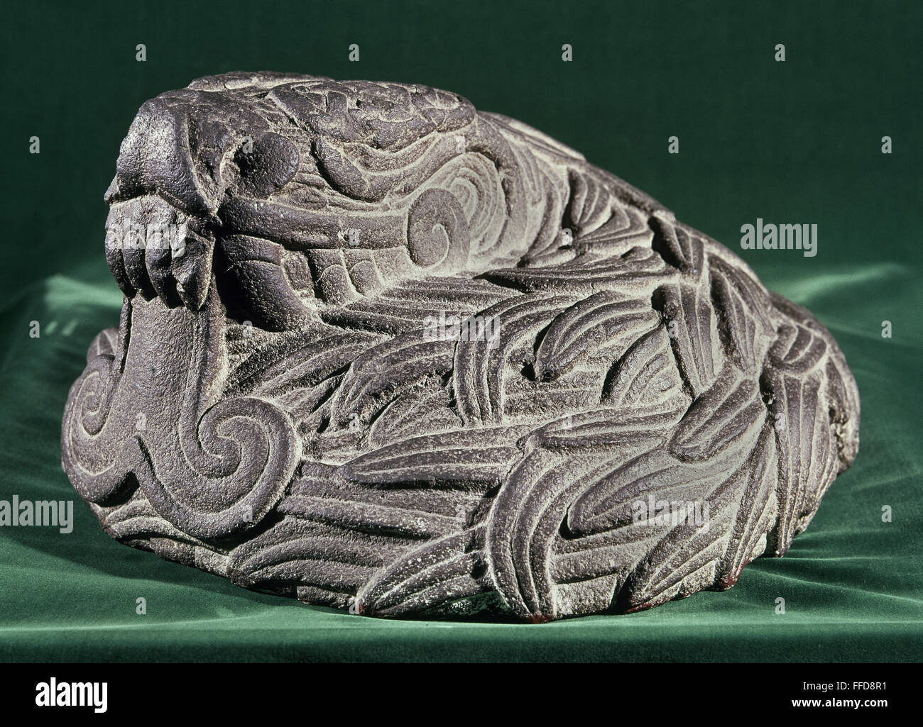 QUETZALCOATL, c1450. /nThe mesoamerican god of Quetzalcoatl, depicted as a coiled, feathered serpent. Stone sculpture, Aztec, from Mexico City, c1450. Stock Photo