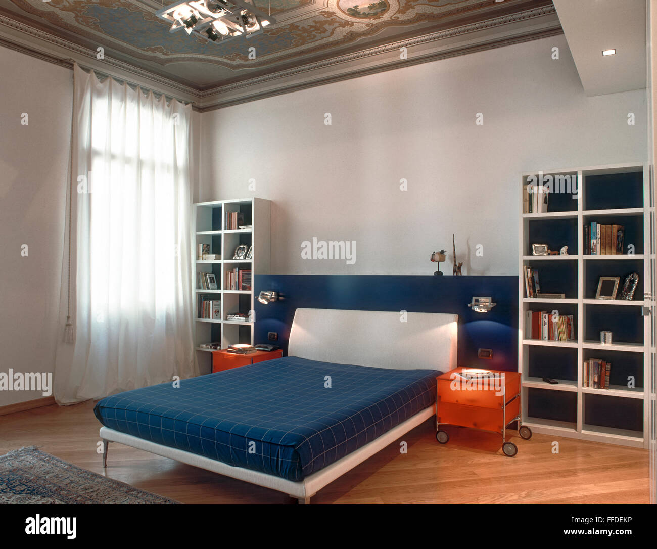 interior view of a classic bedroom with modern bed, fresco and wood floor Stock Photo