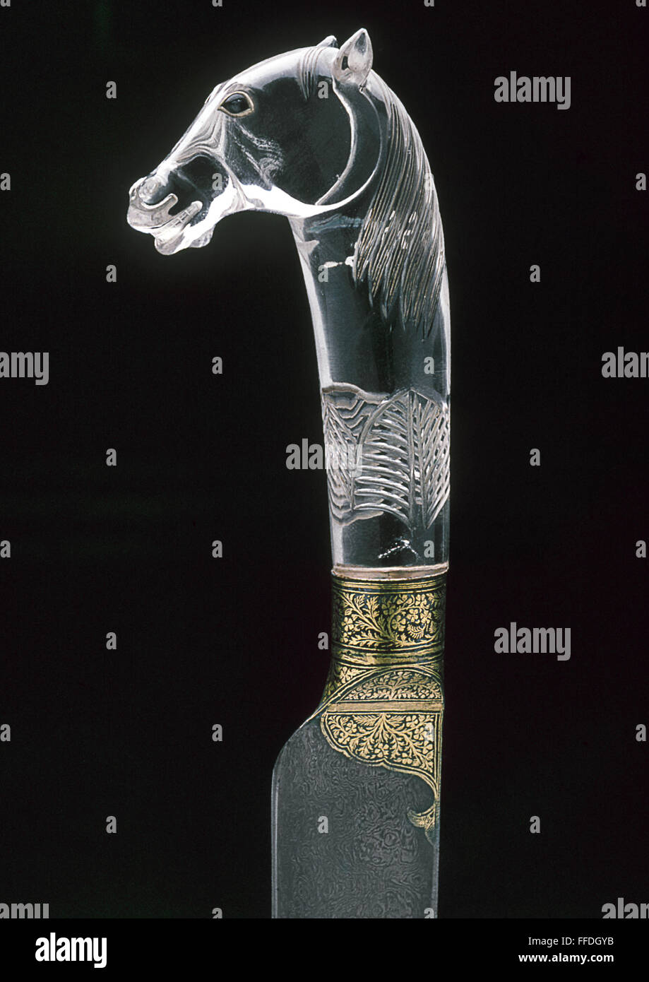 INDIAN DAGGER HILT. /nCarved rock crystal dagger hilt in the shape of a ...