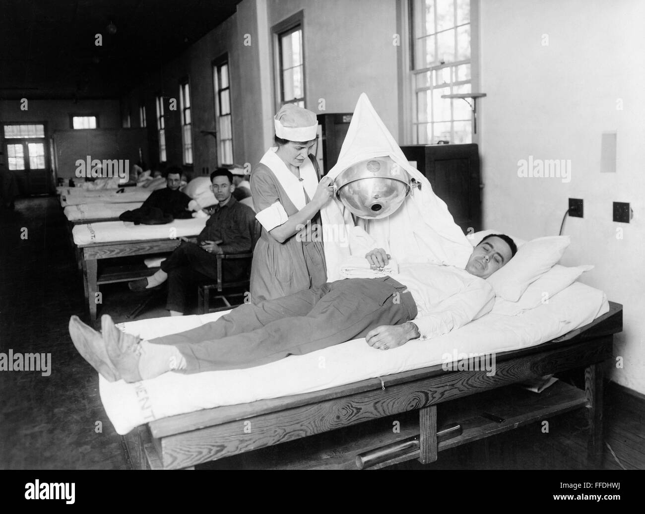 WALTER REED HOSPITAL. /nA Red Cross nurse giving physiotherapy to a ...