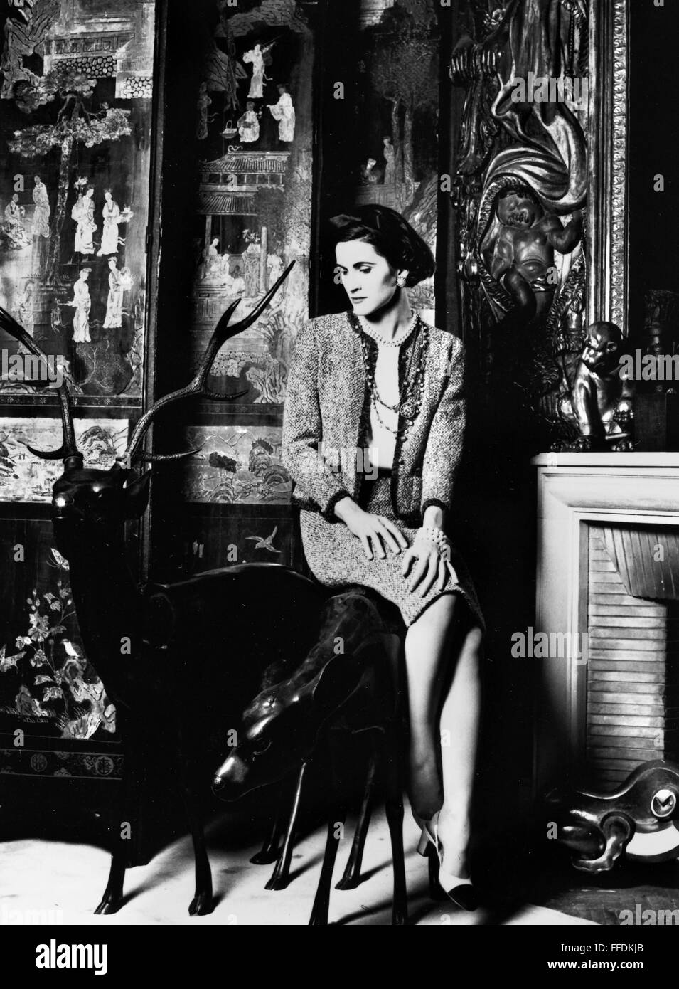 WOMEN'S FASHION, 1956. /nModel wearing a tweed suit designed by Coco Chanel,  1956. Photographed in Chanel's suite at the Ritz Hotel in Paris Stock Photo  - Alamy