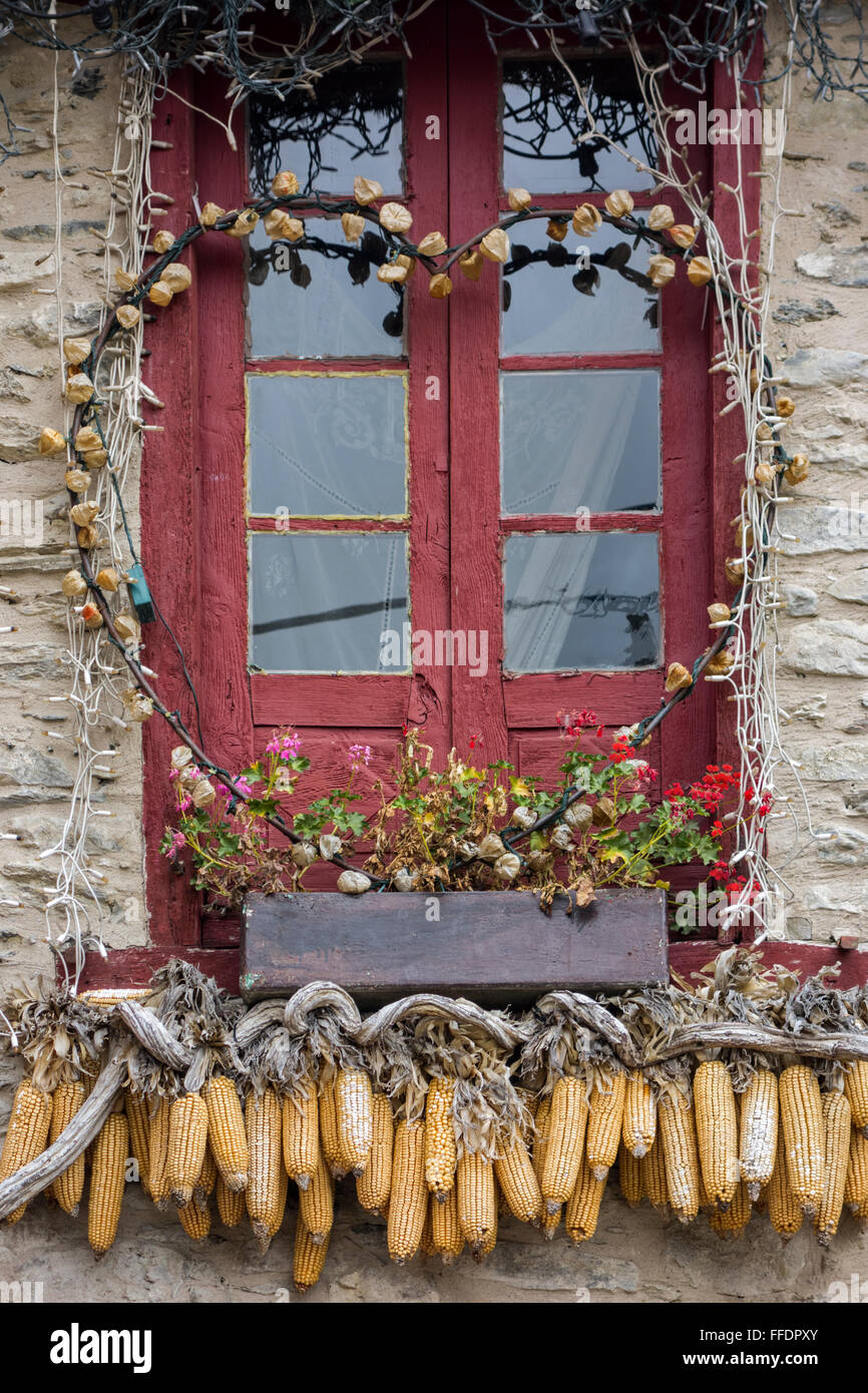 Window decorated with corncobs. Arties village. Pyrenees. Catalunya. Spain Stock Photo