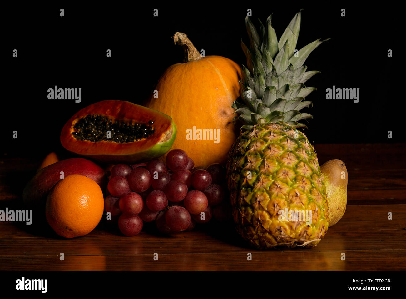 variety of fruits on a wooden table, studio picture Stock Photo - Alamy