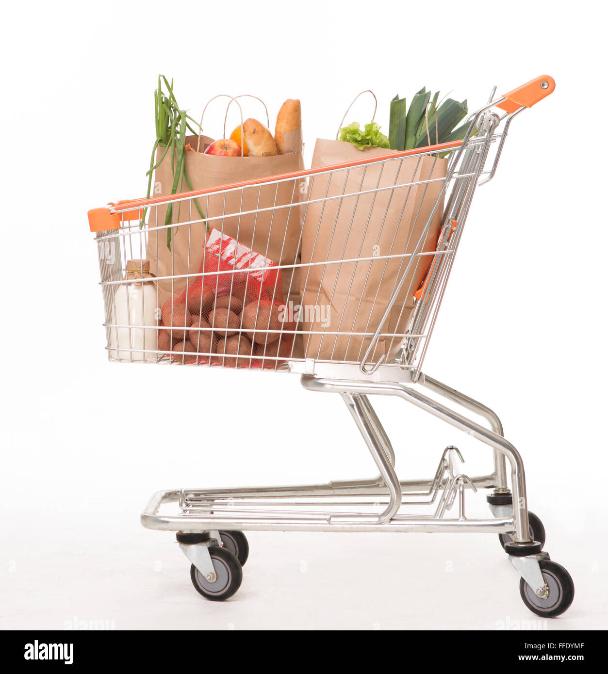 Shopping cart with shopping bags Stock Photo Alamy