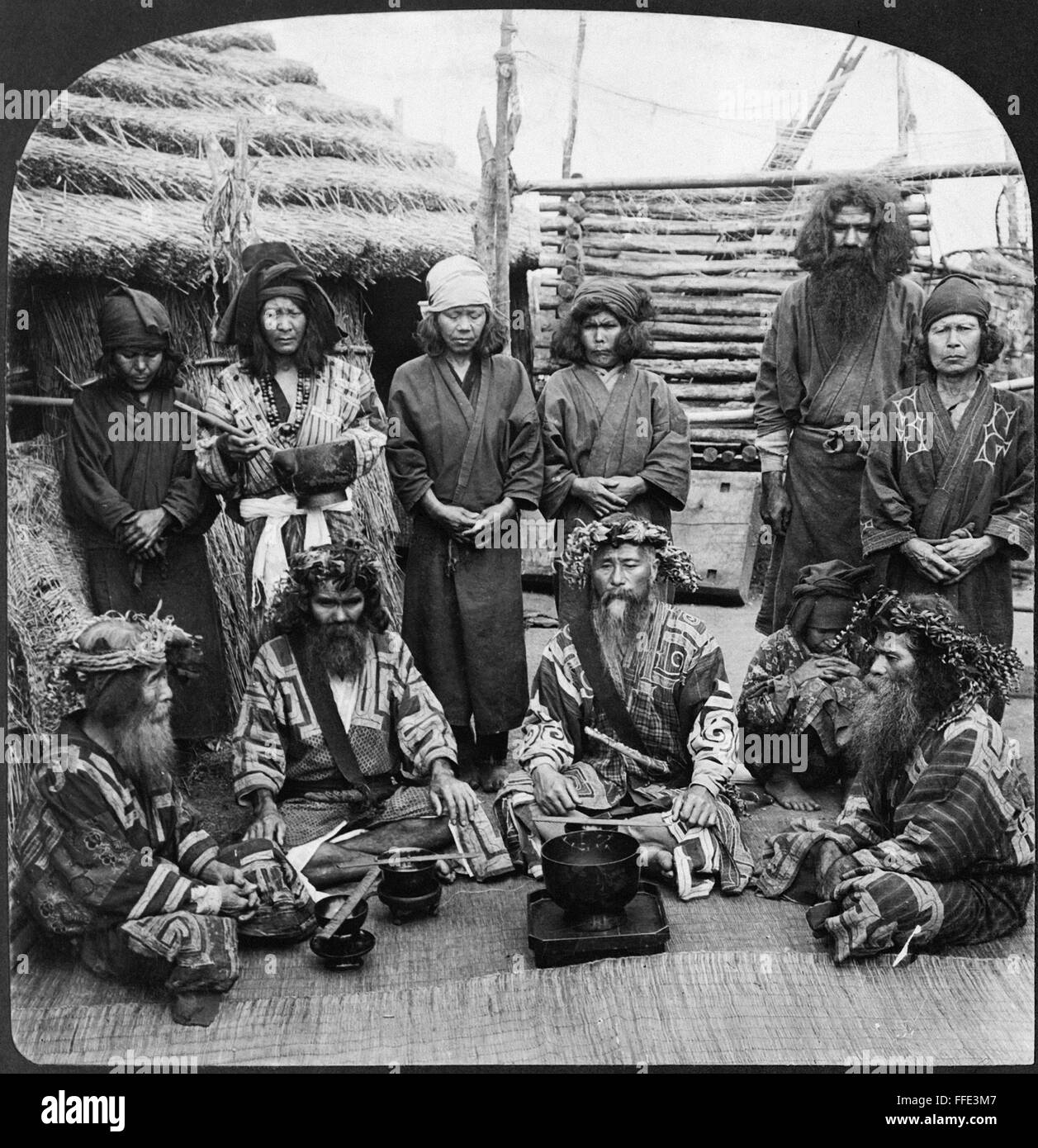 (27 x... JAPAN: AINU, c1906. /nA group of Ainu men dressed in feast attire,...