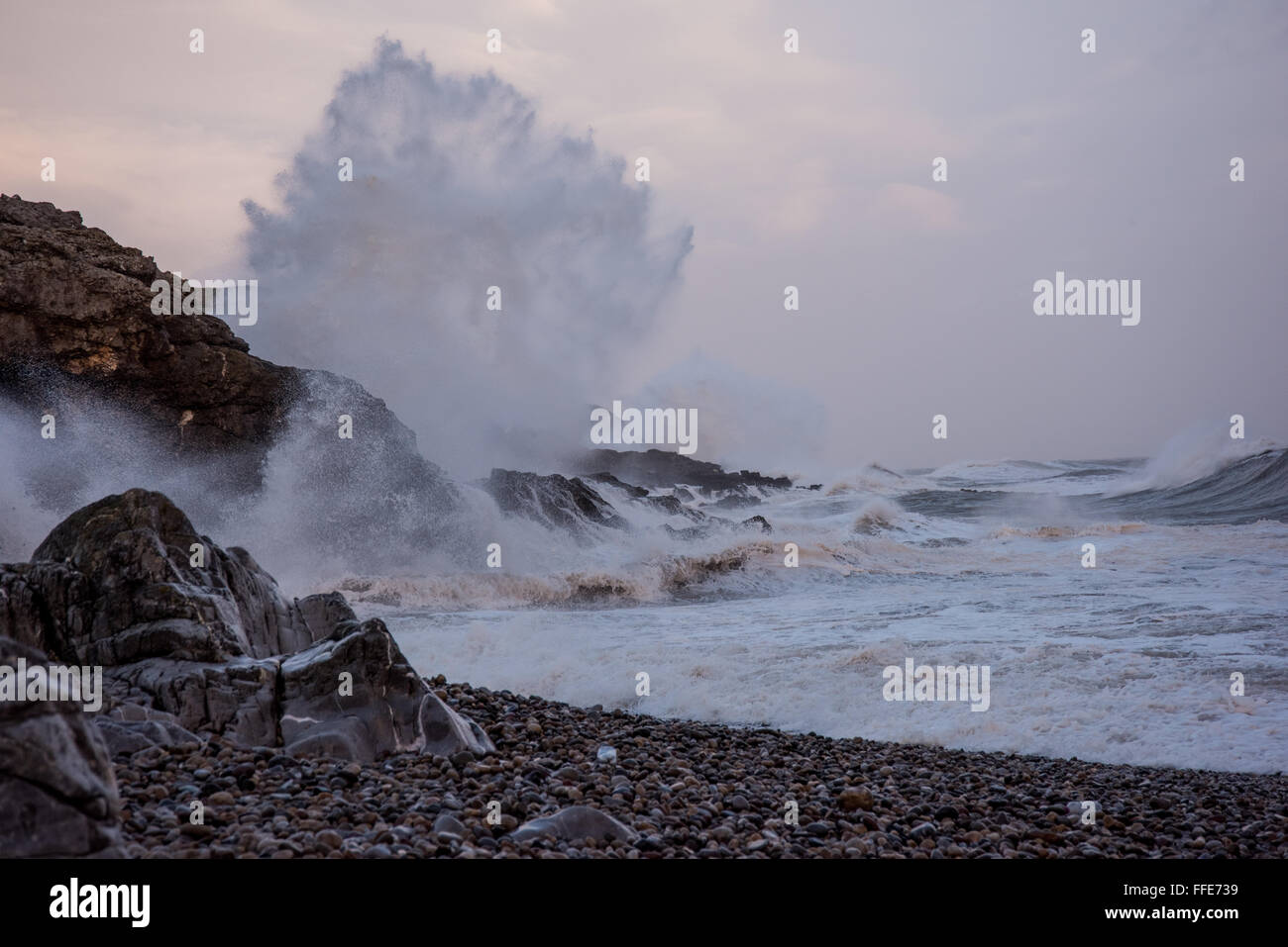 Winter storm Imogen generates rough seas and exploding waves on the rocks of Mumbles Head, South Wales, UK. Stock Photo