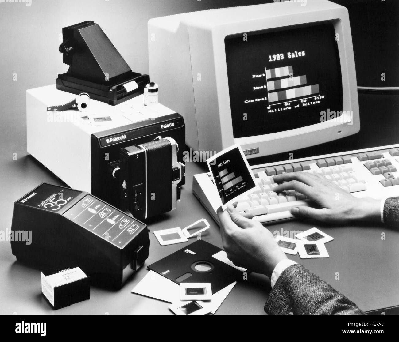 DIGITAL IMAGES, 1984. /nA computer user holds a photographic hard copy,  made with a Polaroid Palette computer image recorder (left), of an image  initially created on a Digital Rainbow personal computer. Photographed