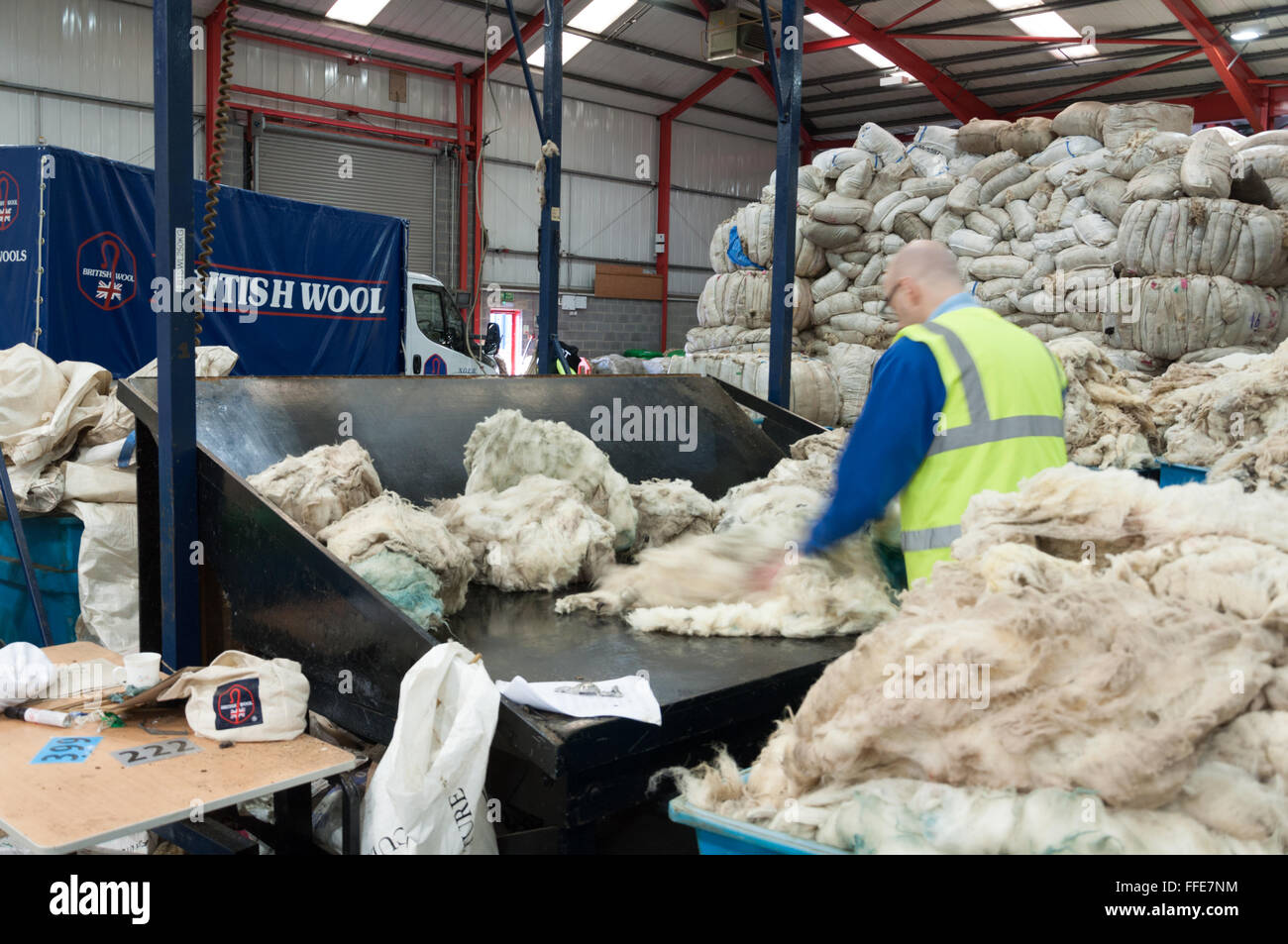 A British wool sorter grading and sorting wool Stock Photo Alamy