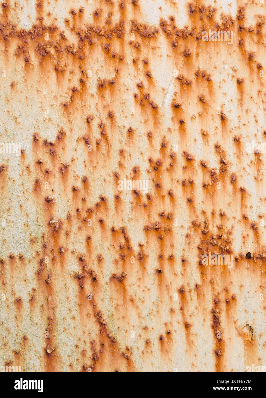 Lots of rust spots and marks on white painted metal surface. Stock Photo