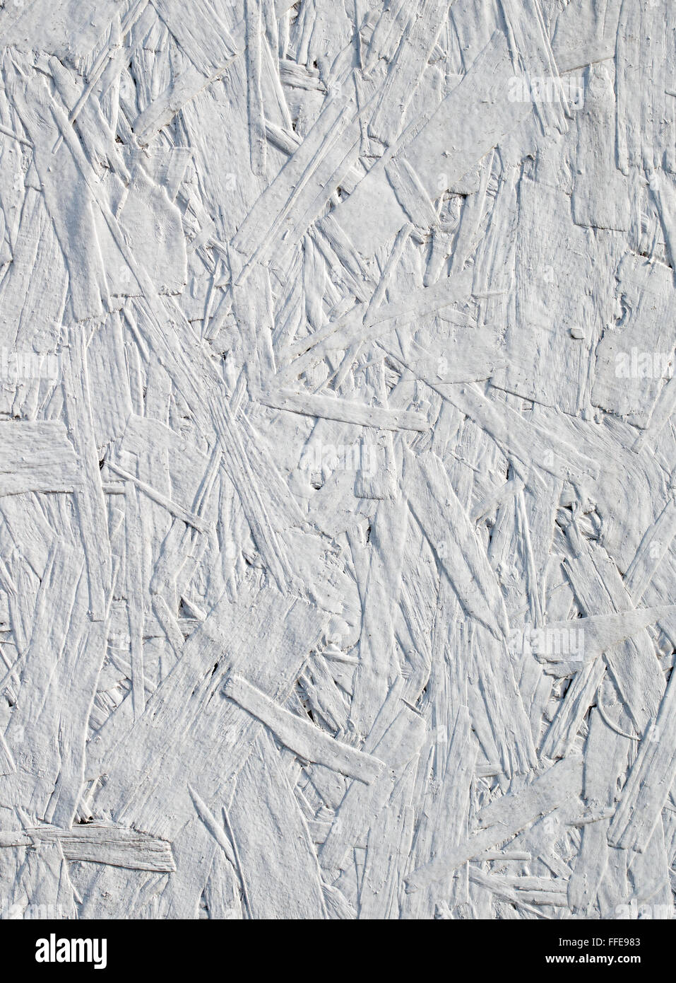 Recycled oriented strand board painted white close up. Stock Photo
