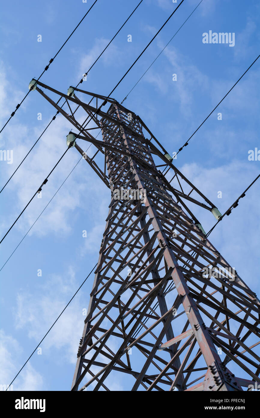 Power pole with high voltage against the blue sky Stock Photo - Alamy