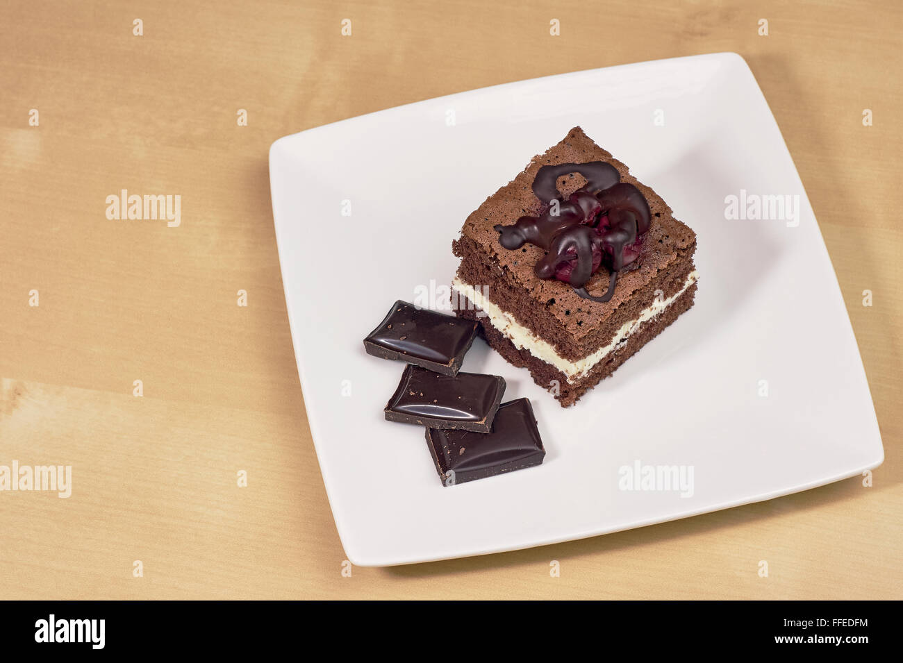 Chocolate cake with lemon cream Stock Photo - Alamy