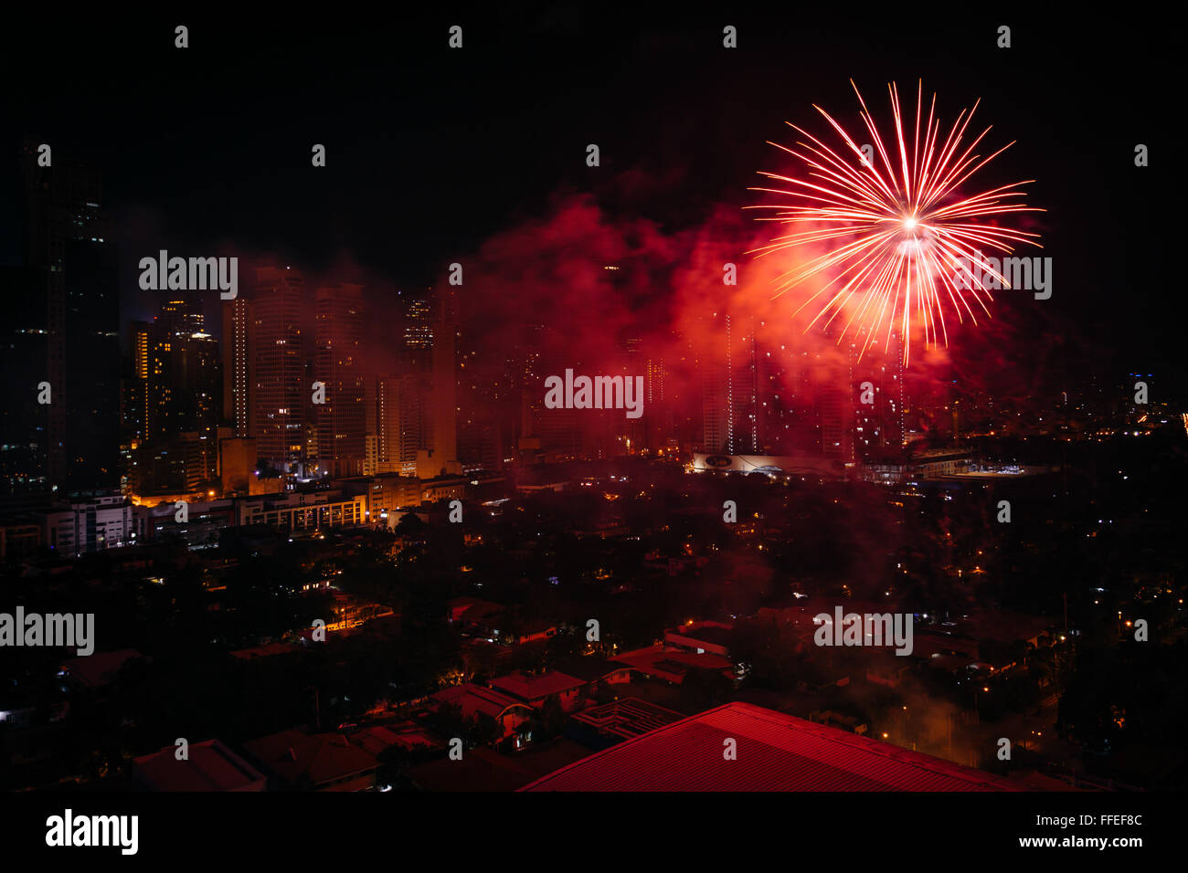 Chinese New Year fireworks over Makati at night, in Metro Manila, The Philippines. Stock Photo