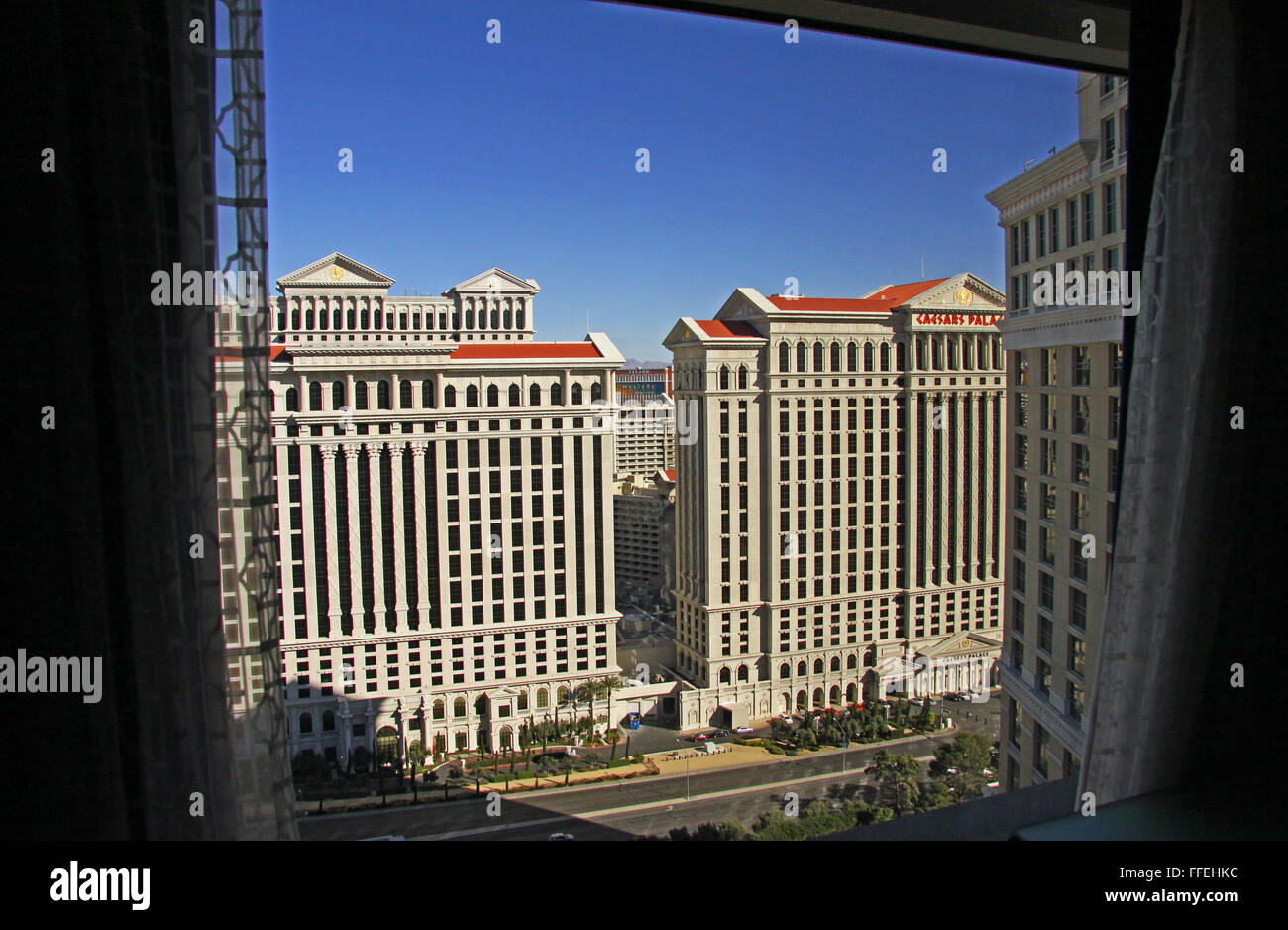 picture window view from the Bellagio Hotel towards Caesers Palace Hotel in Las Vegas Stock Photo