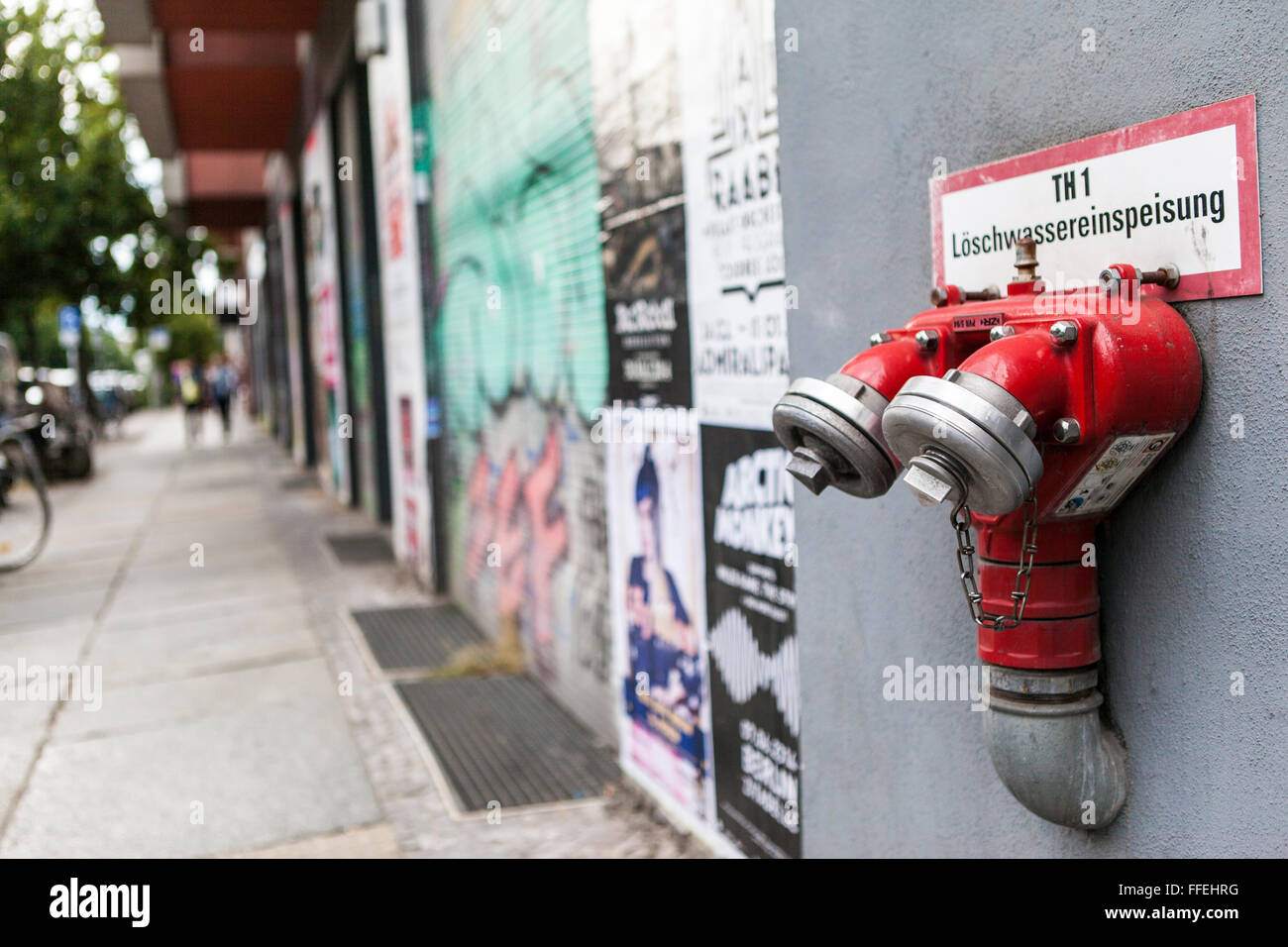 Fire hydrant on wall Stock Photo
