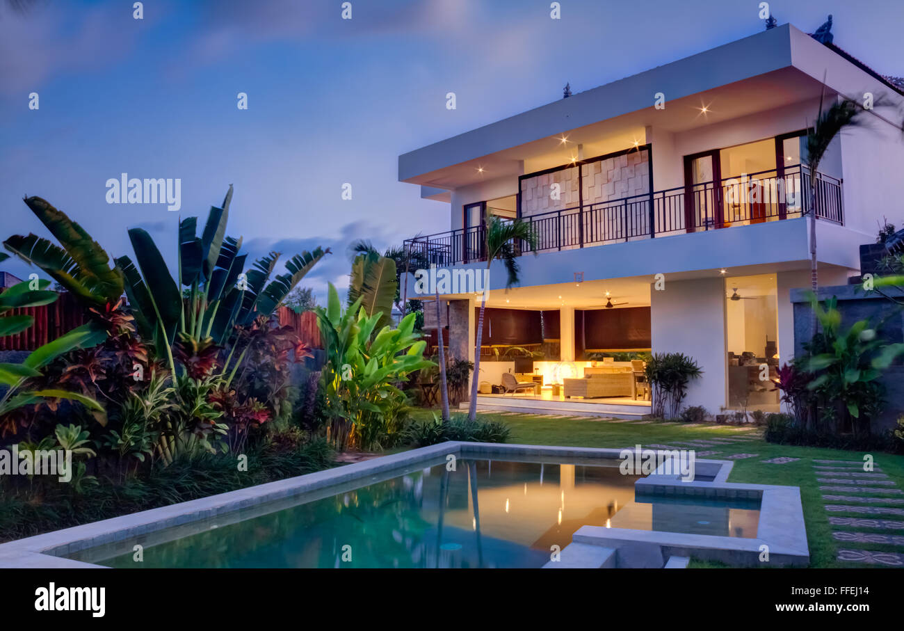 Tropical villa at sunset Stock Photo - Alamy