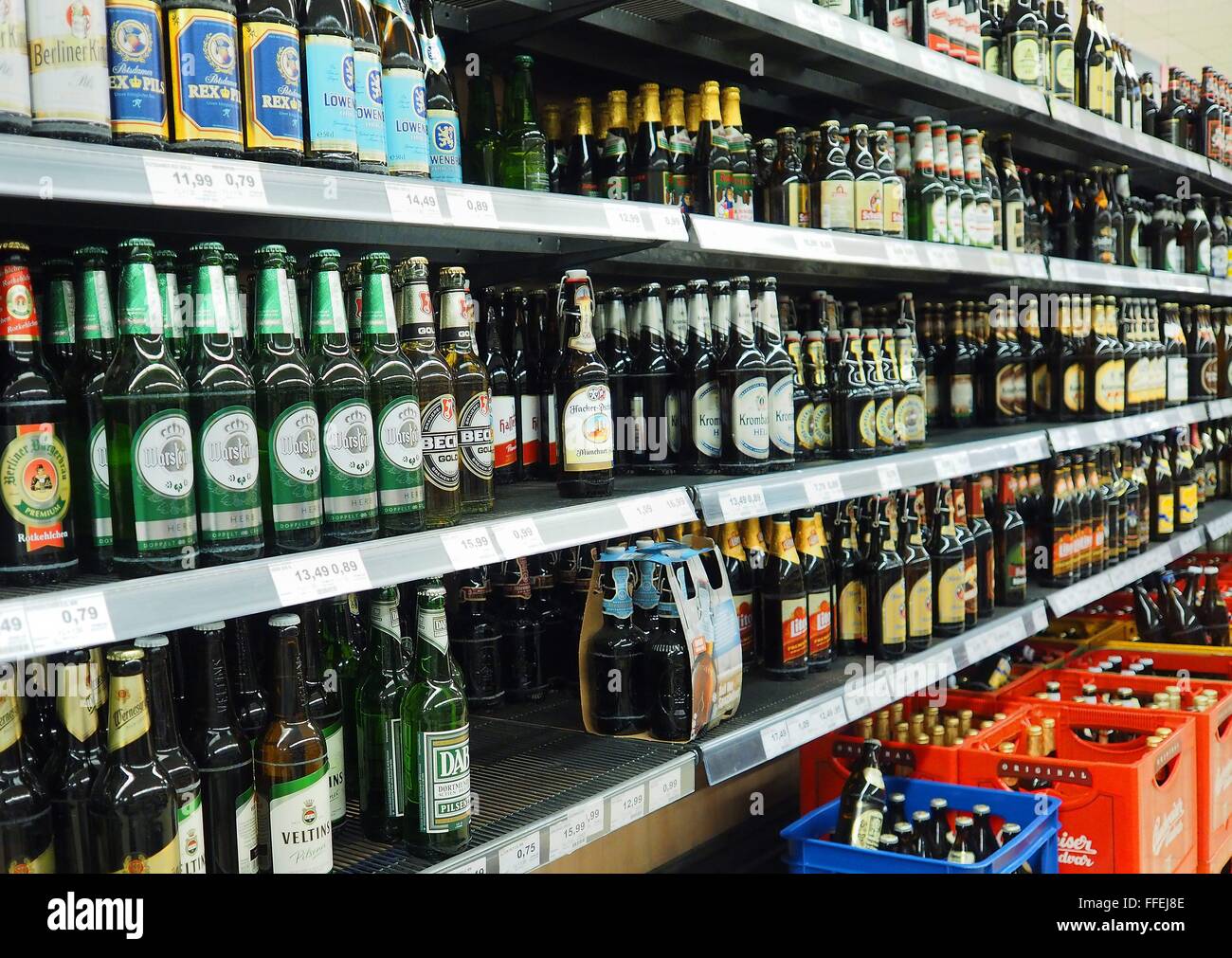 Beer bottles are seen on a shelf of a supermarket in Berlin on January 04, 2016. Photo: Wolfram Steinberg/dpa Stock Photo