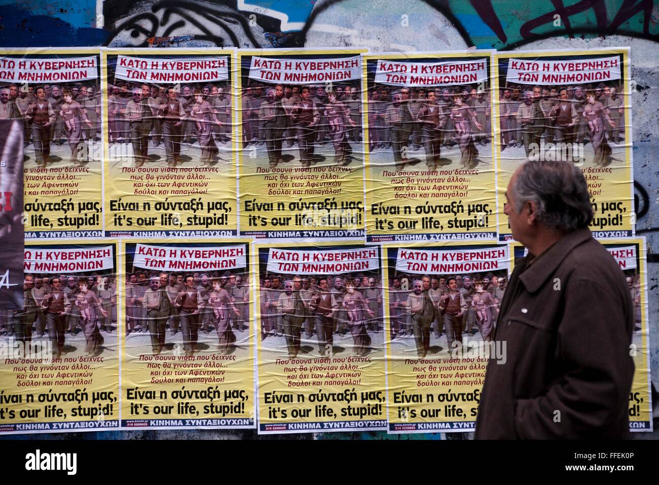 Greek pensioners in front of poster against Government, writing 'It is our life, stupid'. Unions call for 24hrs. strike, against planned reform at pension- and sozial insurance system of Greece. 04.02.2016 Stock Photo