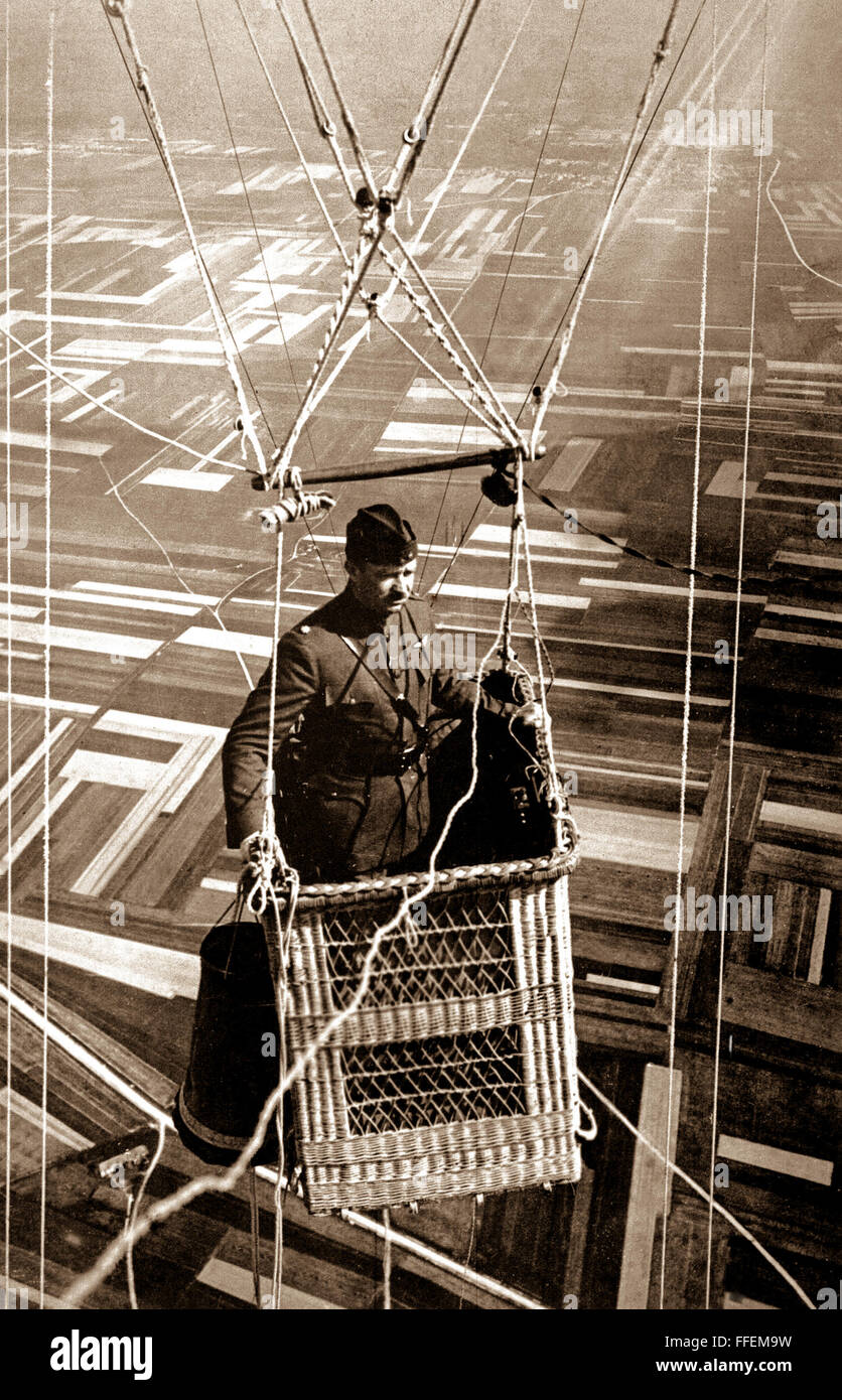 Close-up view of an American major in the basket of an observation balloon flying over territory near front lines.  June 1918.  (Army)    This archival print is available in the following sizes:    8' x 10'   $15.95 w/ FREE SHIPPING  11' x 14' $23.95 w/ FREE SHIPPING  16' x 20' $59.95 w/ FREE SHIPPING  20' x 24' $99.95 w/ FREE SHIPPING    * The American Photoarchive watermark will not appear on your print. Stock Photo