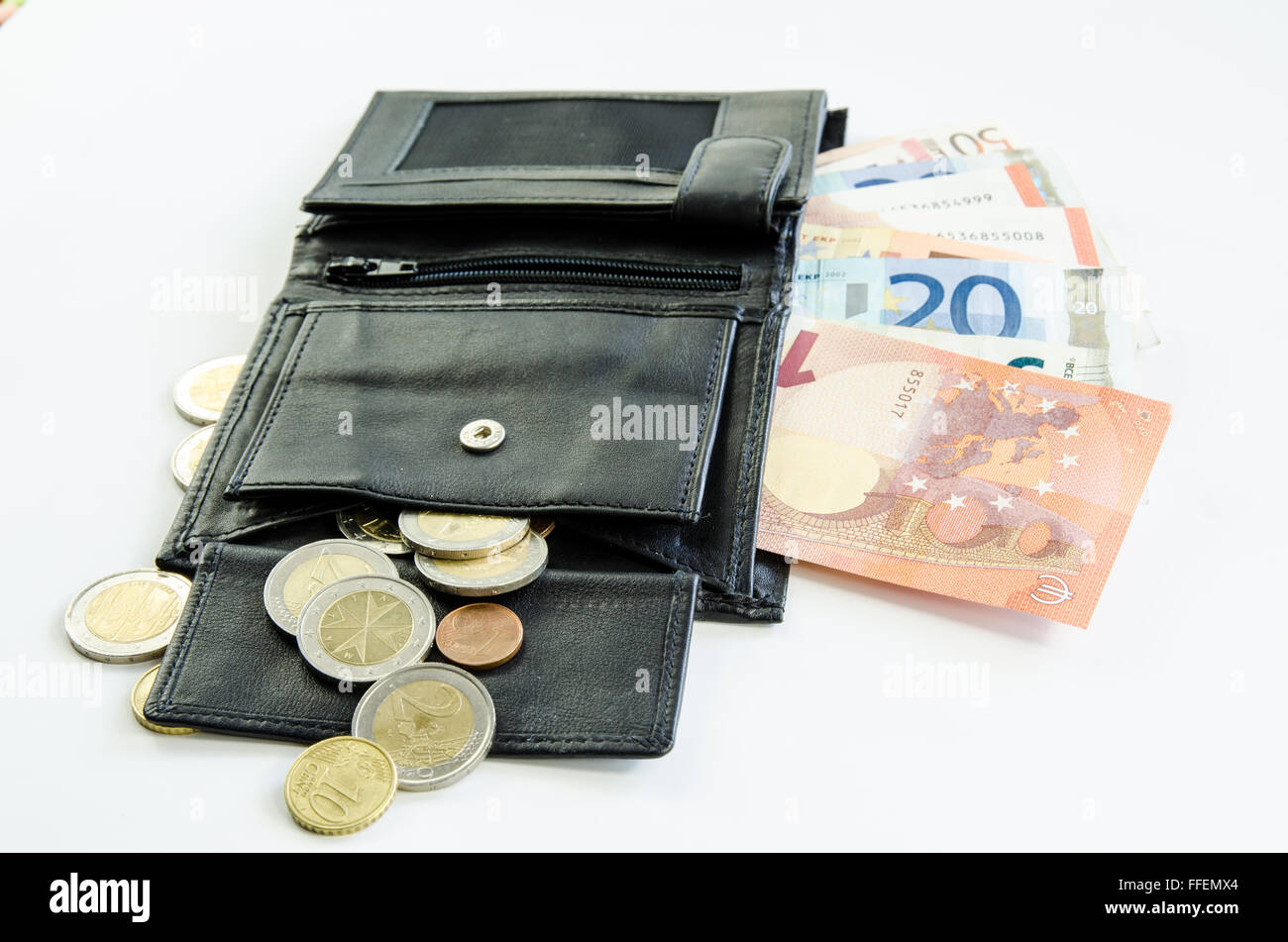 banknotes and coins in black purse Stock Photo - Alamy
