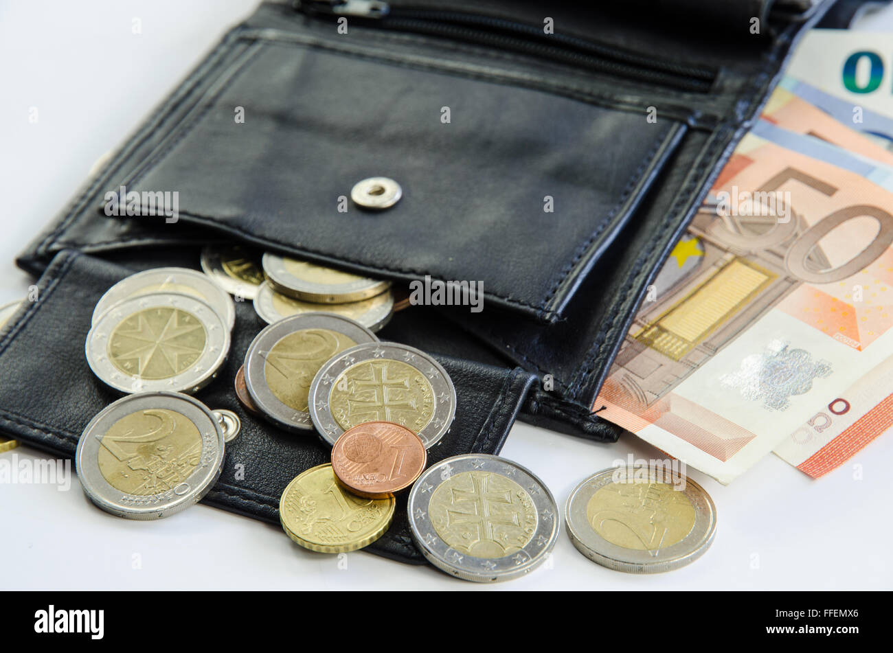 banknotes and coins in black purse Stock Photo - Alamy