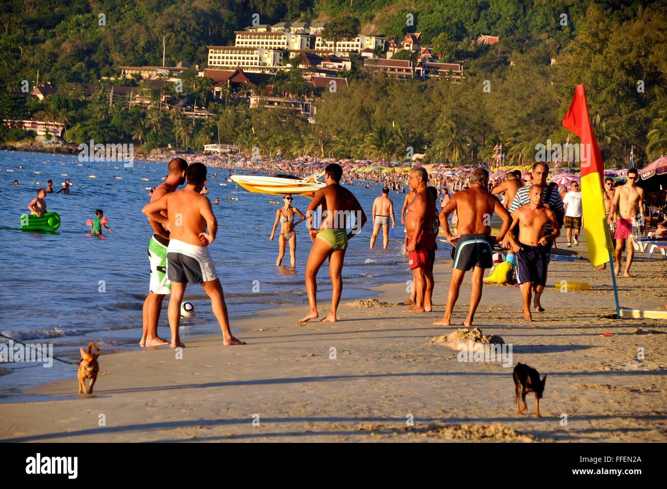 Phuket, Thailand: Crowded Patong Beach filled with vacationers enjoying the sand and surf Stock Photo