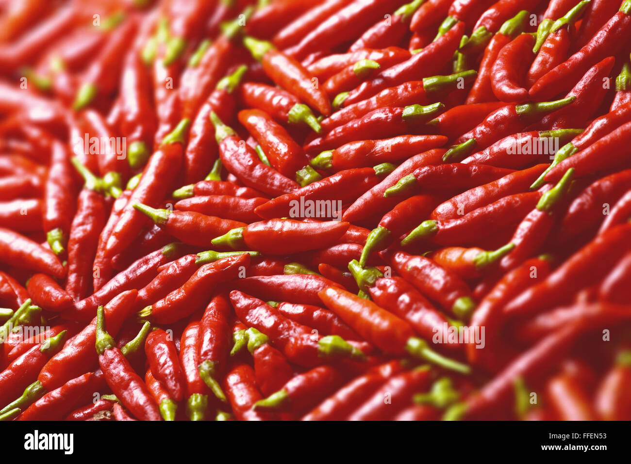 Image of red peppers with depth of field and focus on the center. Stock Photo