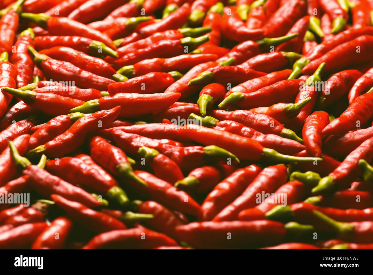 Image of red peppers with depth of field and focus on the center. Stock Photo
